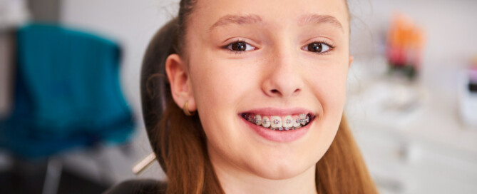 kid wearing traditional braces
